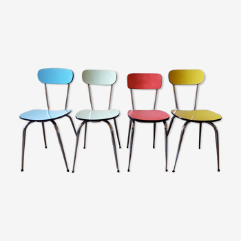 Four formica chairs in different colors