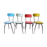 Four formica chairs in different colors