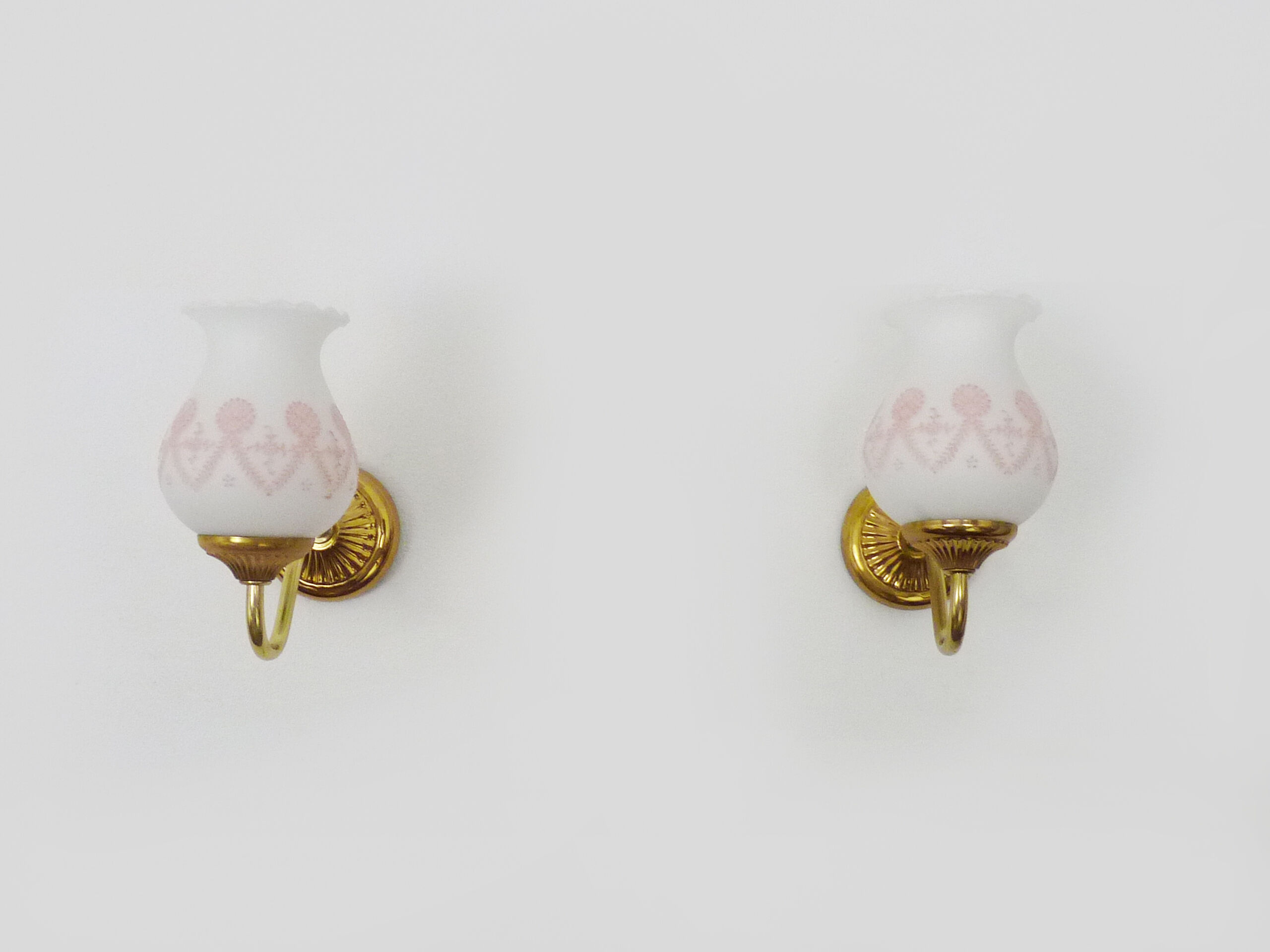 Pair of gooseneck wall sconces in gilded metal, white opaline with pink decorations