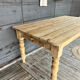 Old farmhouse table in raw wood