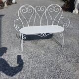 Old garden bench in solid wrought iron