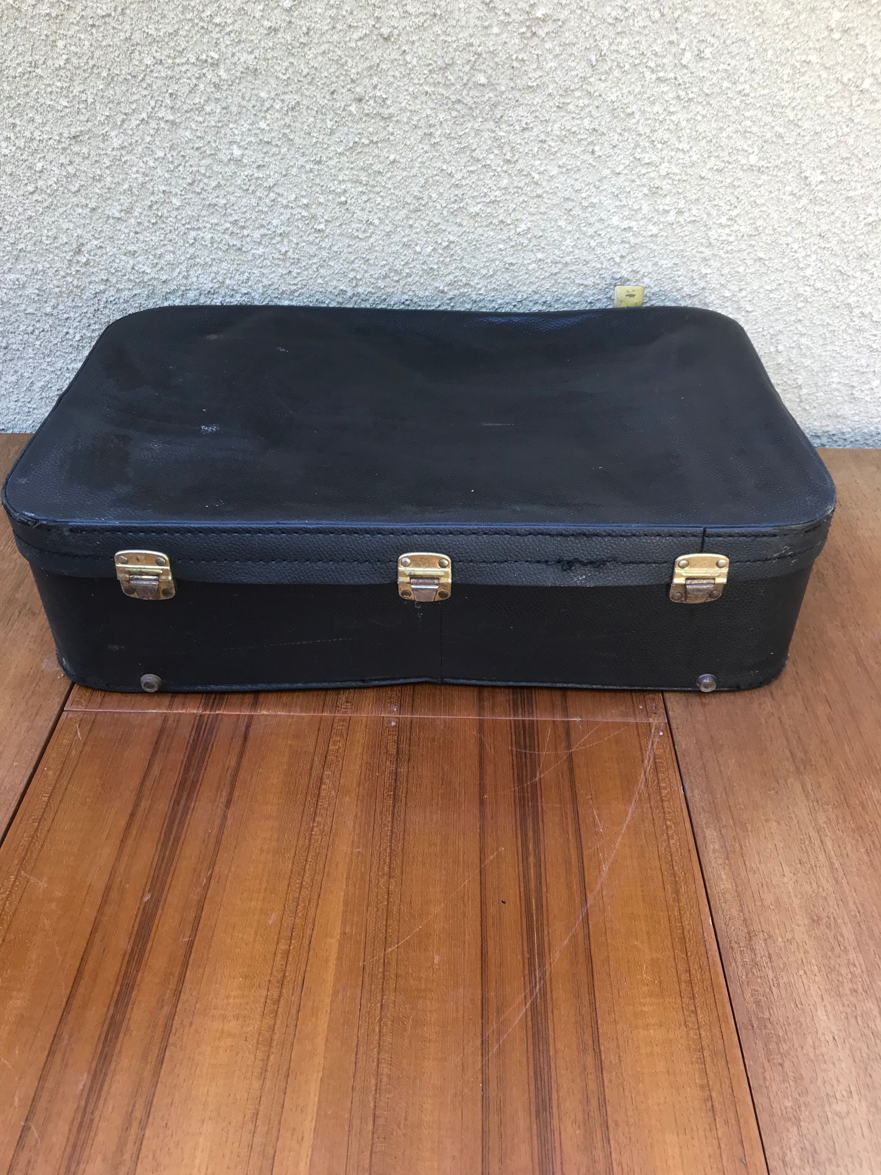 Former skai black travel suitcase