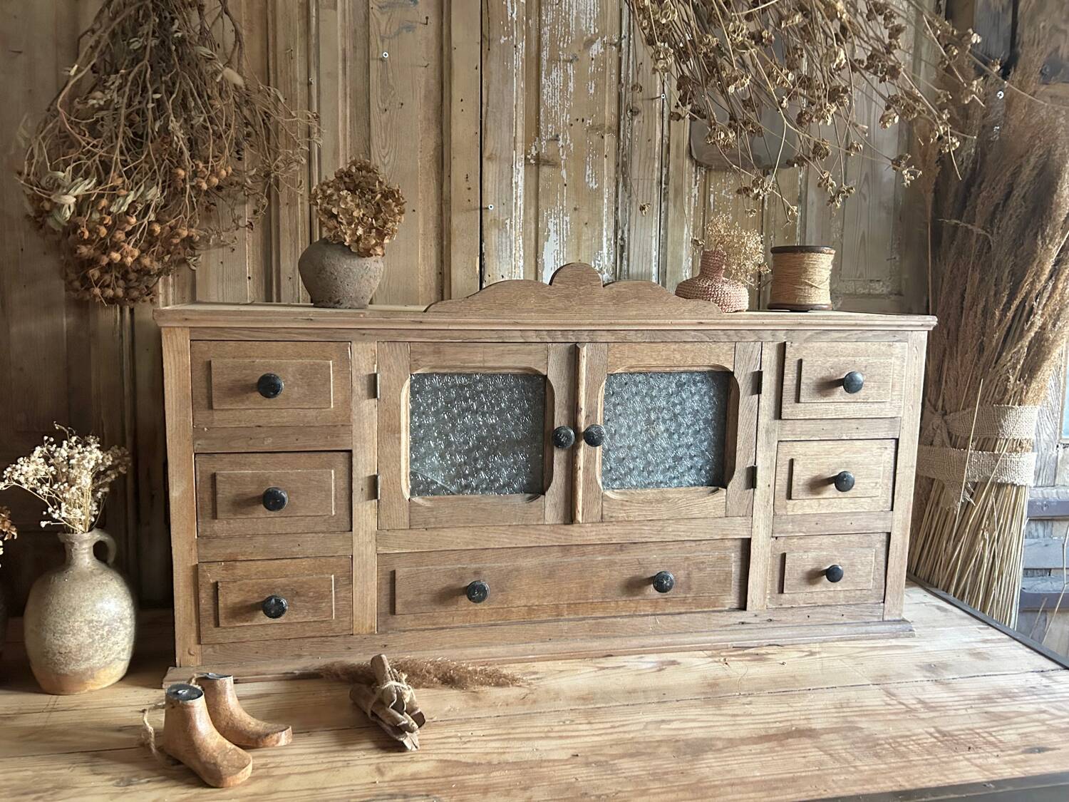 Small piece of furniture with glass doors and drawers