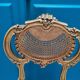 Antique rococo chair in gilded wood and caning