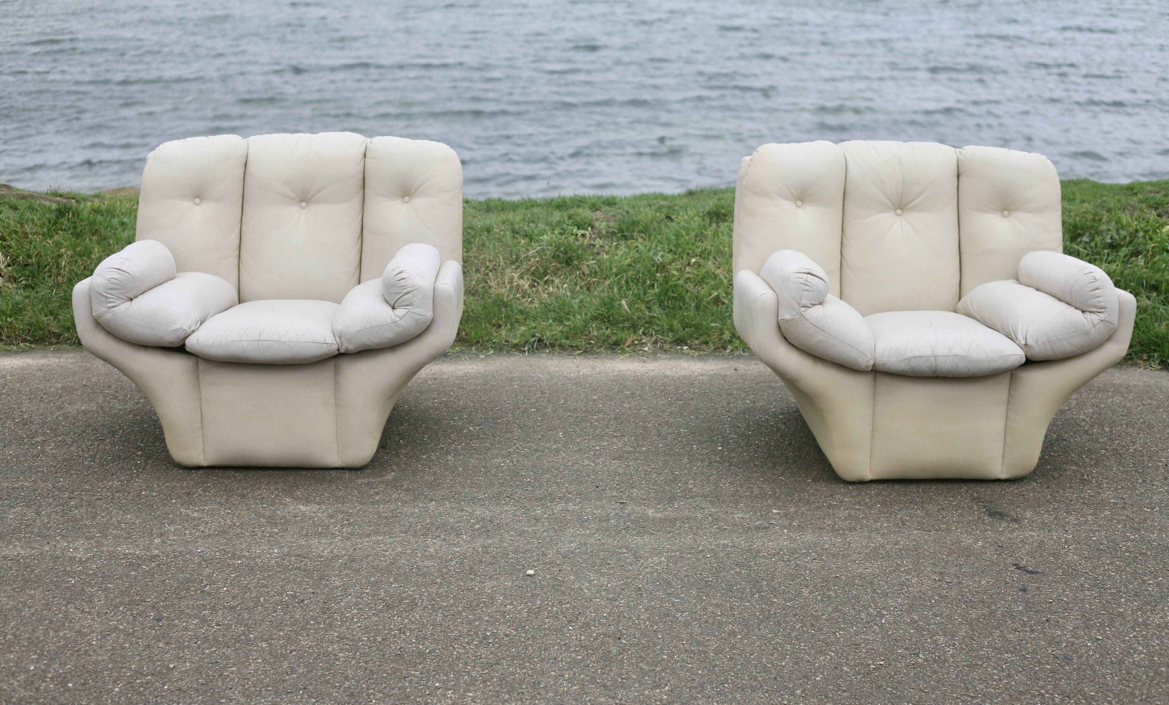 Pair of leather “space age” armchairs. Cream colour". Circa 1970.