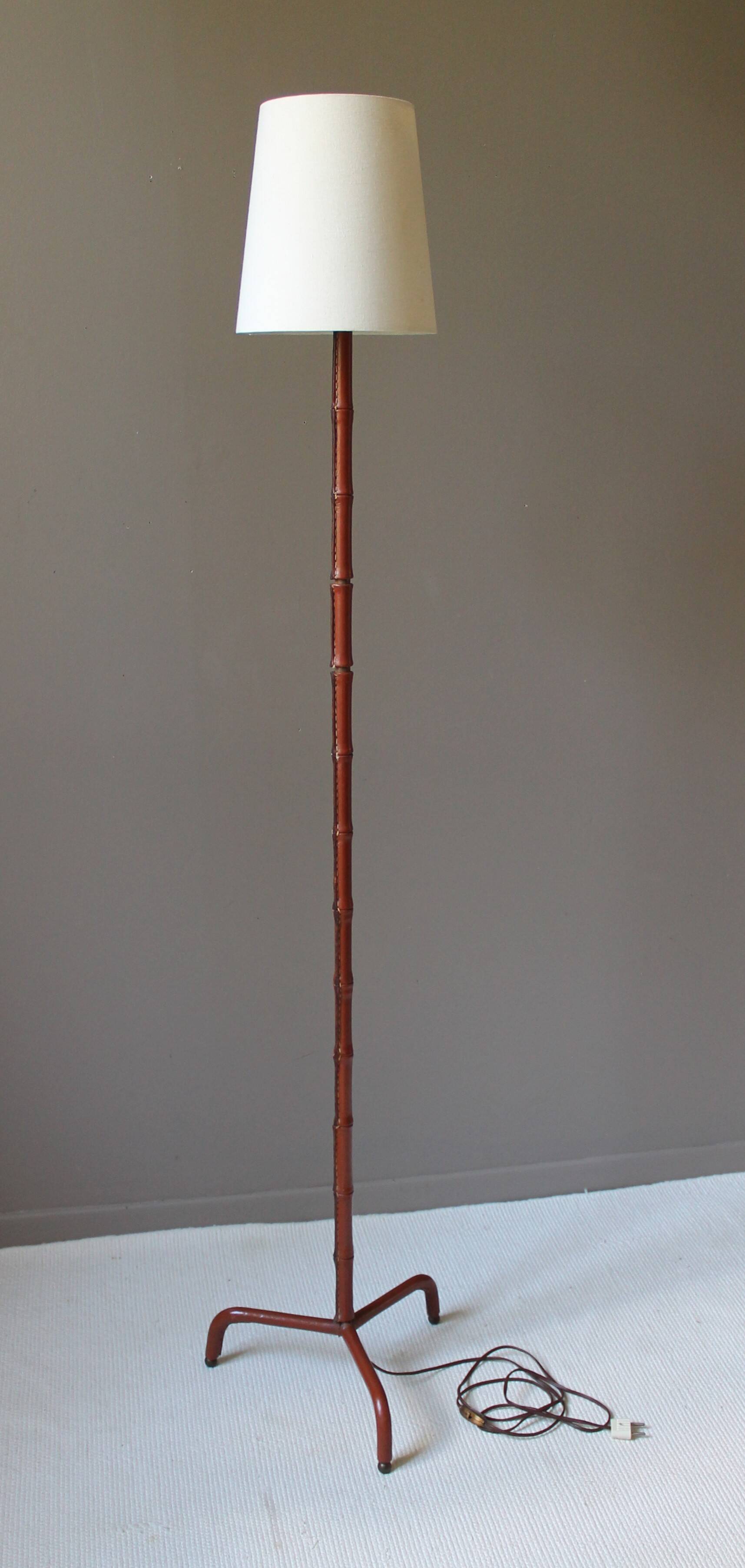 Vintage floor lamp with bamboo-style leather base