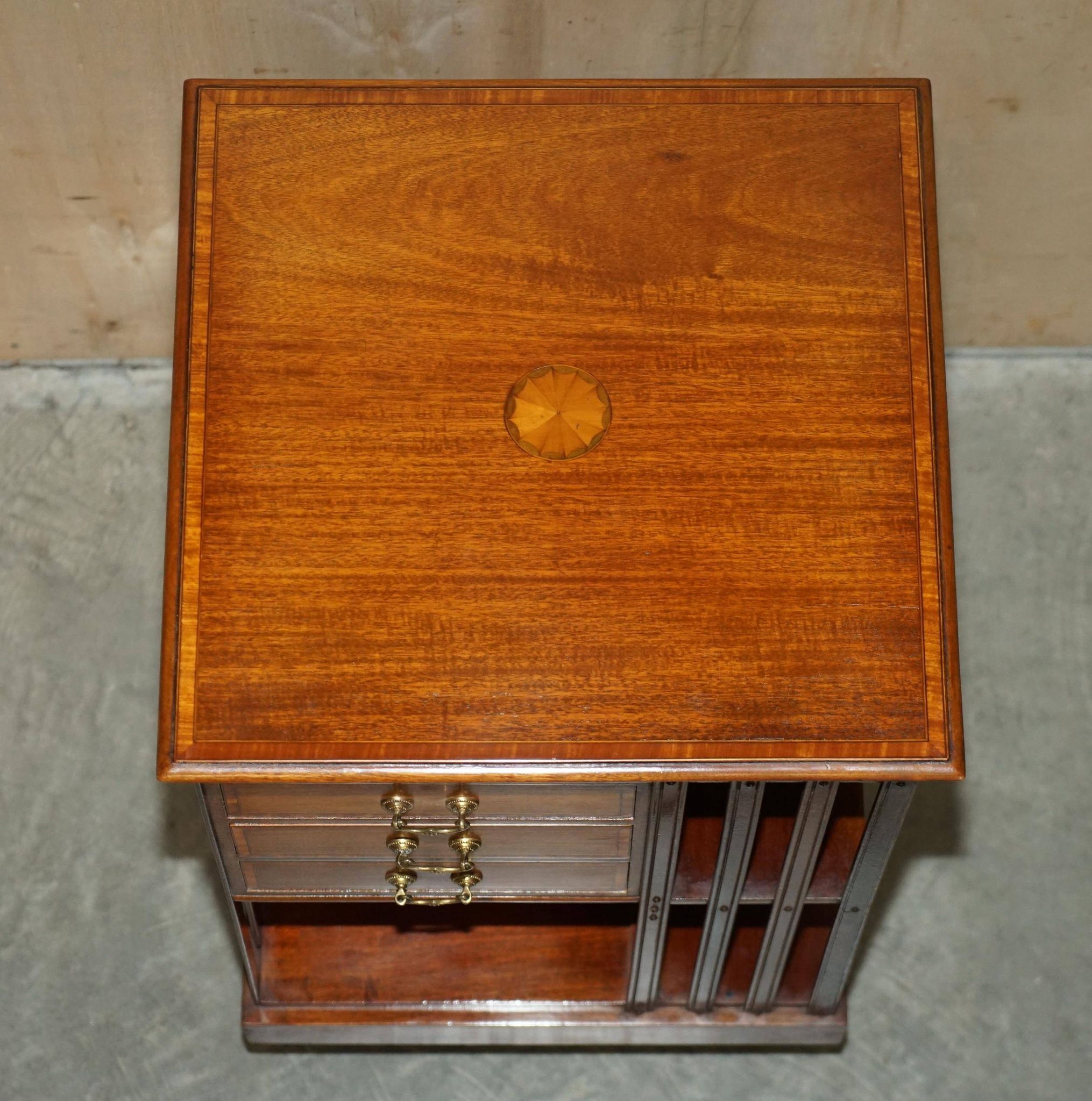 Restored Victorian walnut revolving library.