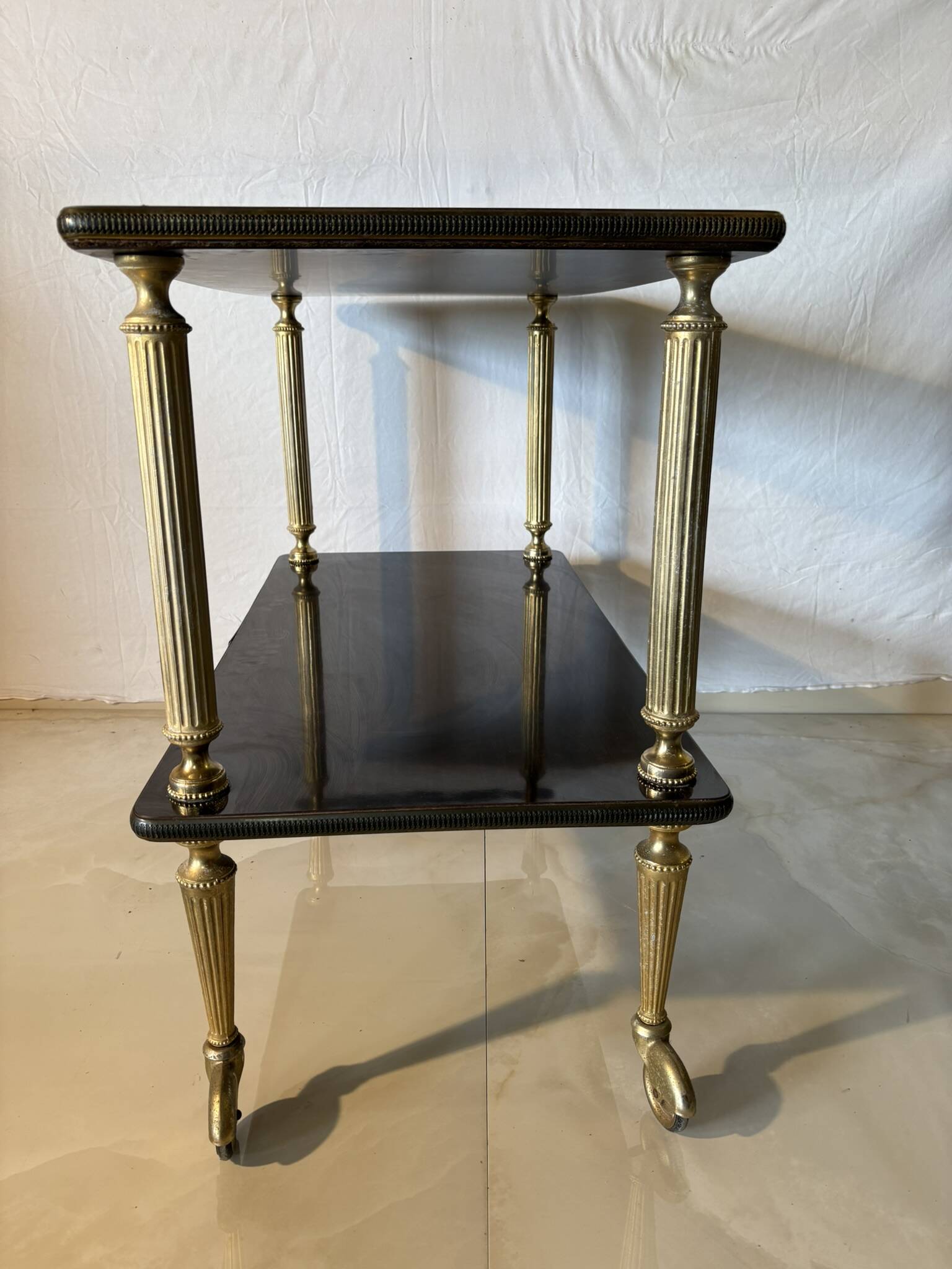 Vintage trolley on wheels, black wood and brass uprights