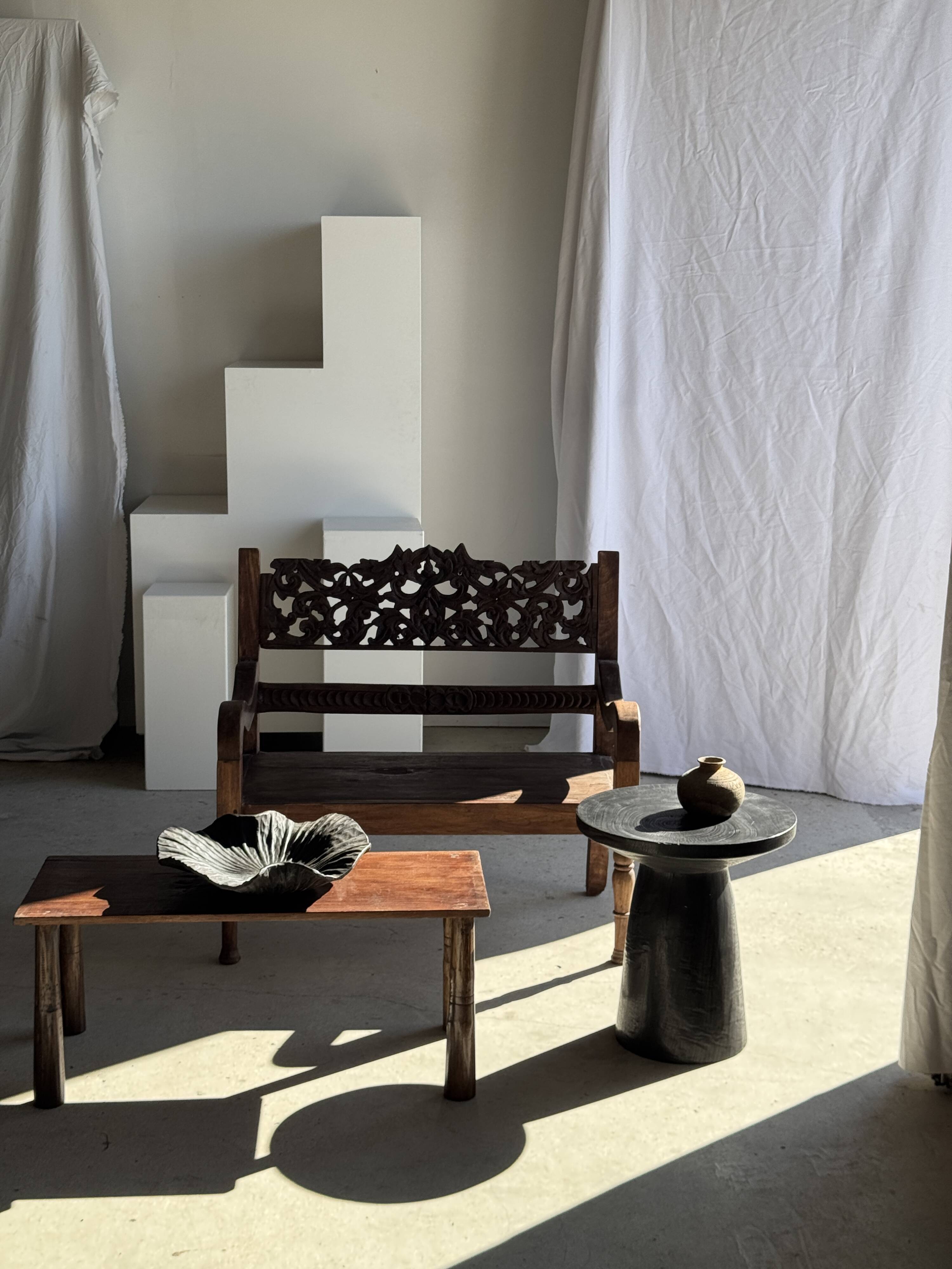 Black solid mango side table (monoxyle) with conical legs