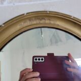 Oval mirror in gilded stucco 45 cm