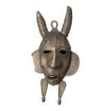 Handcrafted bronze wall mask, Sénoufo African art.