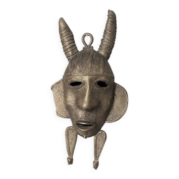Handcrafted bronze wall mask, Sénoufo African art.