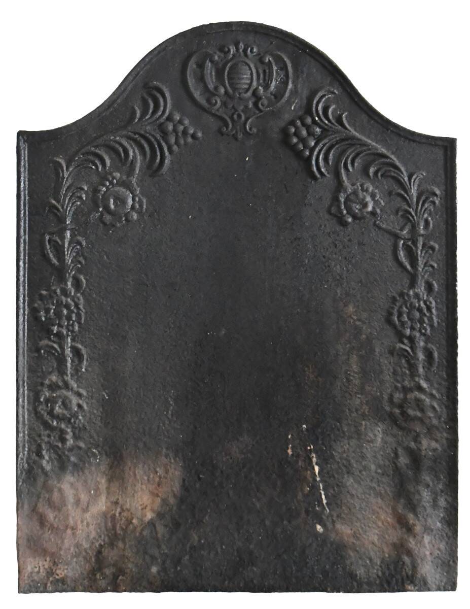 Old cast iron fireplace plaque