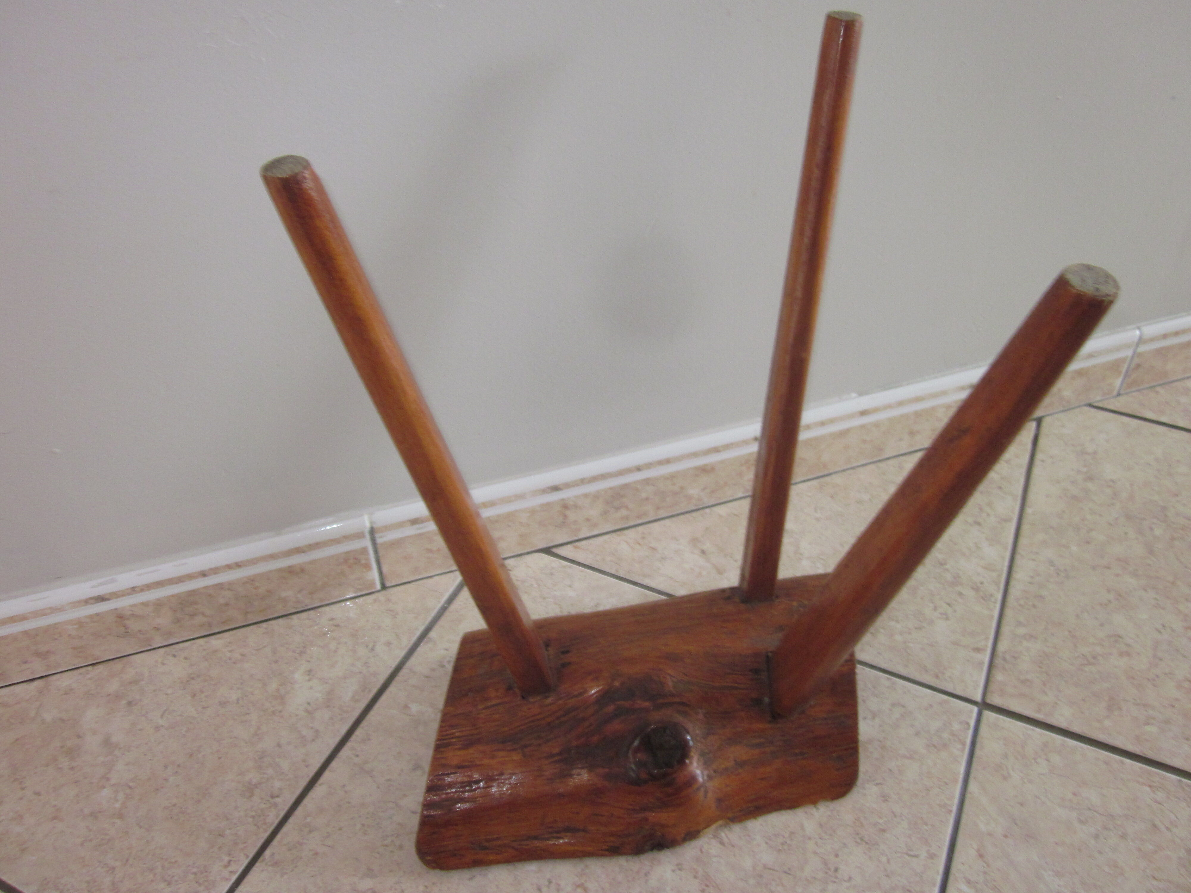 Raw wooden tripod stool
