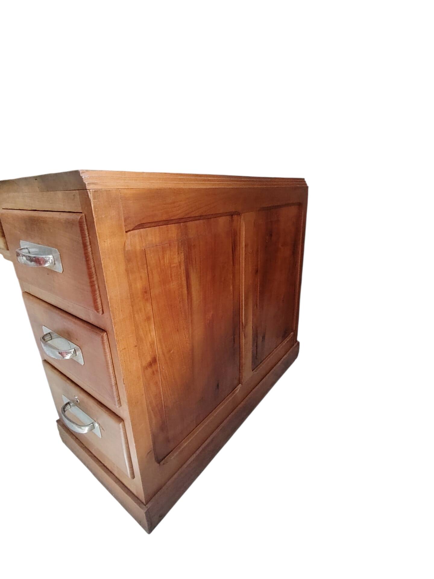 Large modernist minister's desk in solid lemon wood with 7 drawers.