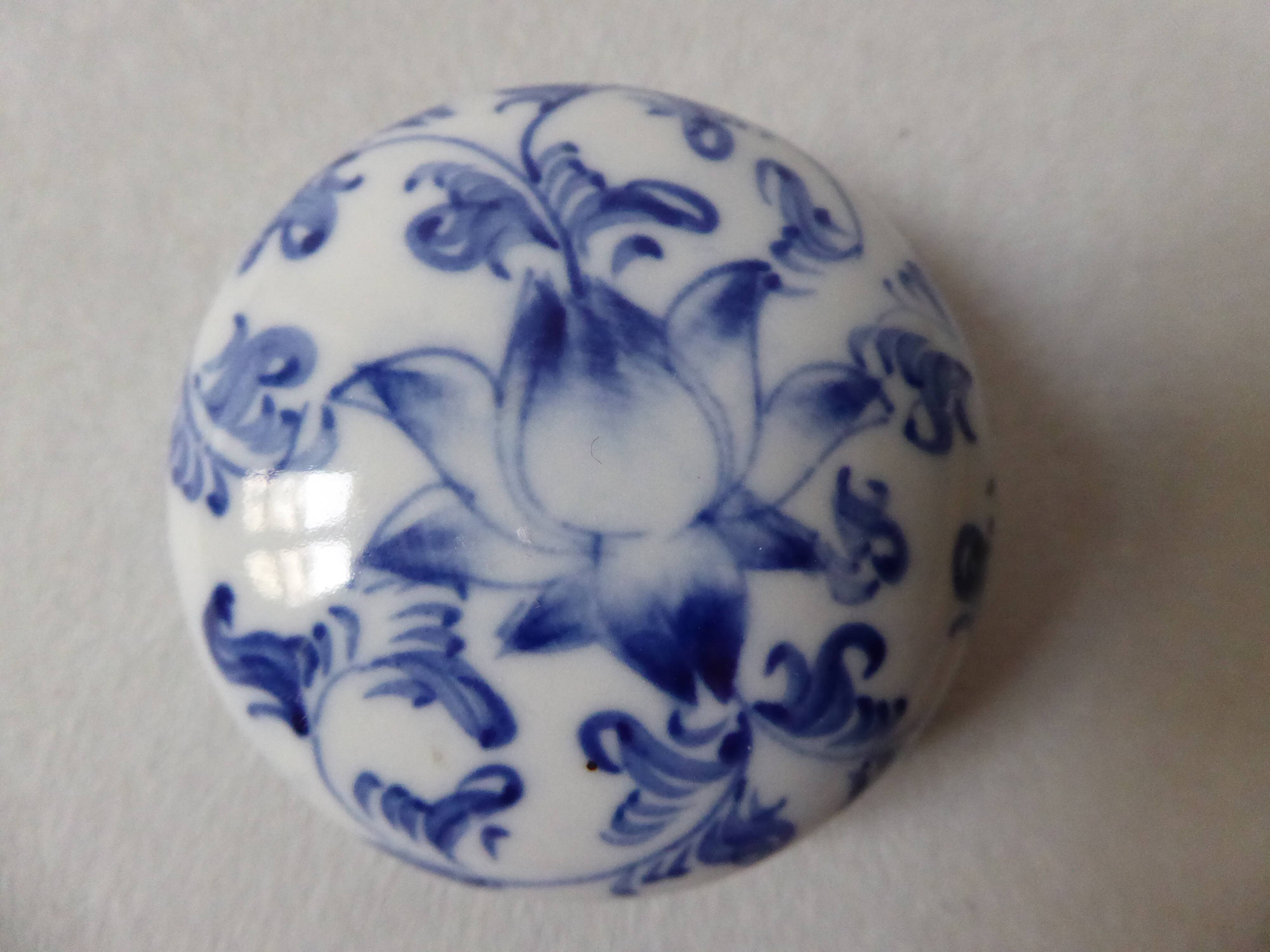 Porcelain pill box decorated with blue and white flowers