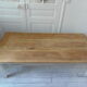 Coffee table made from an authentic farmhouse table, leg patinated pearl gray