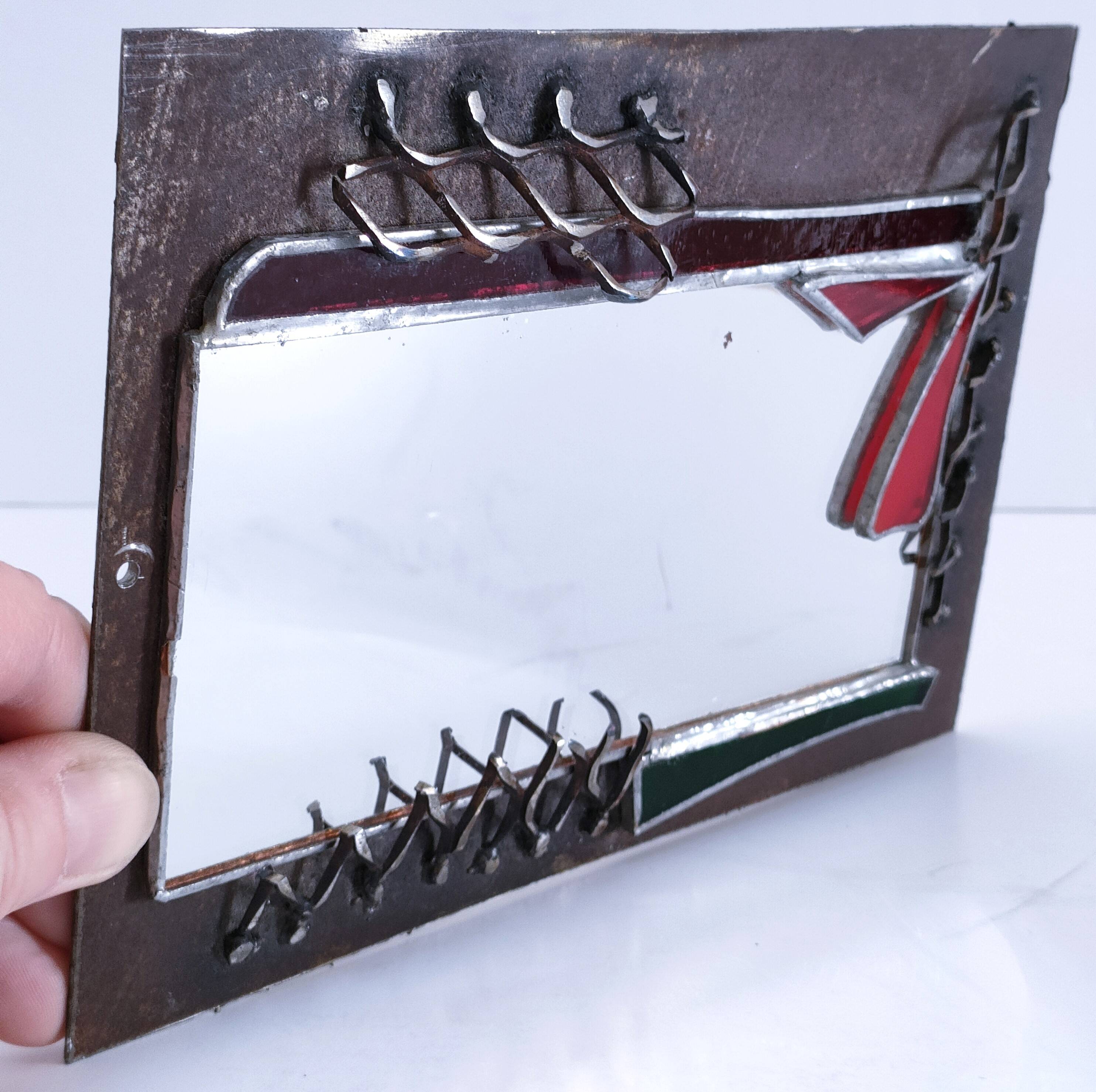 Brutalist mirror in metal and set glass