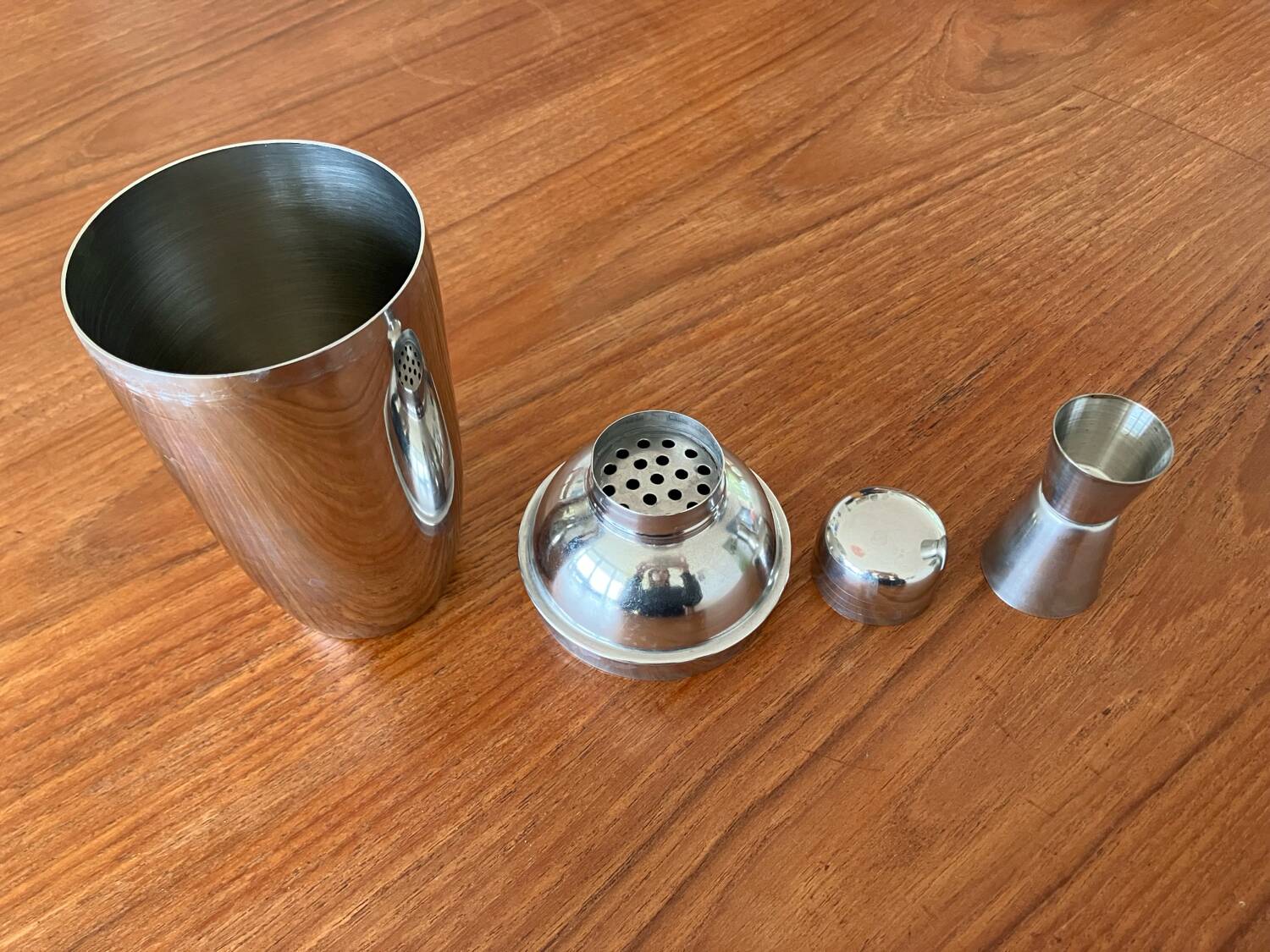 Shaker and five cocktail glasses