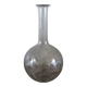 Antique glass carafe with a round belly and floral neck.