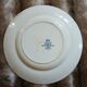 13 mismatched flat plates in ironstone