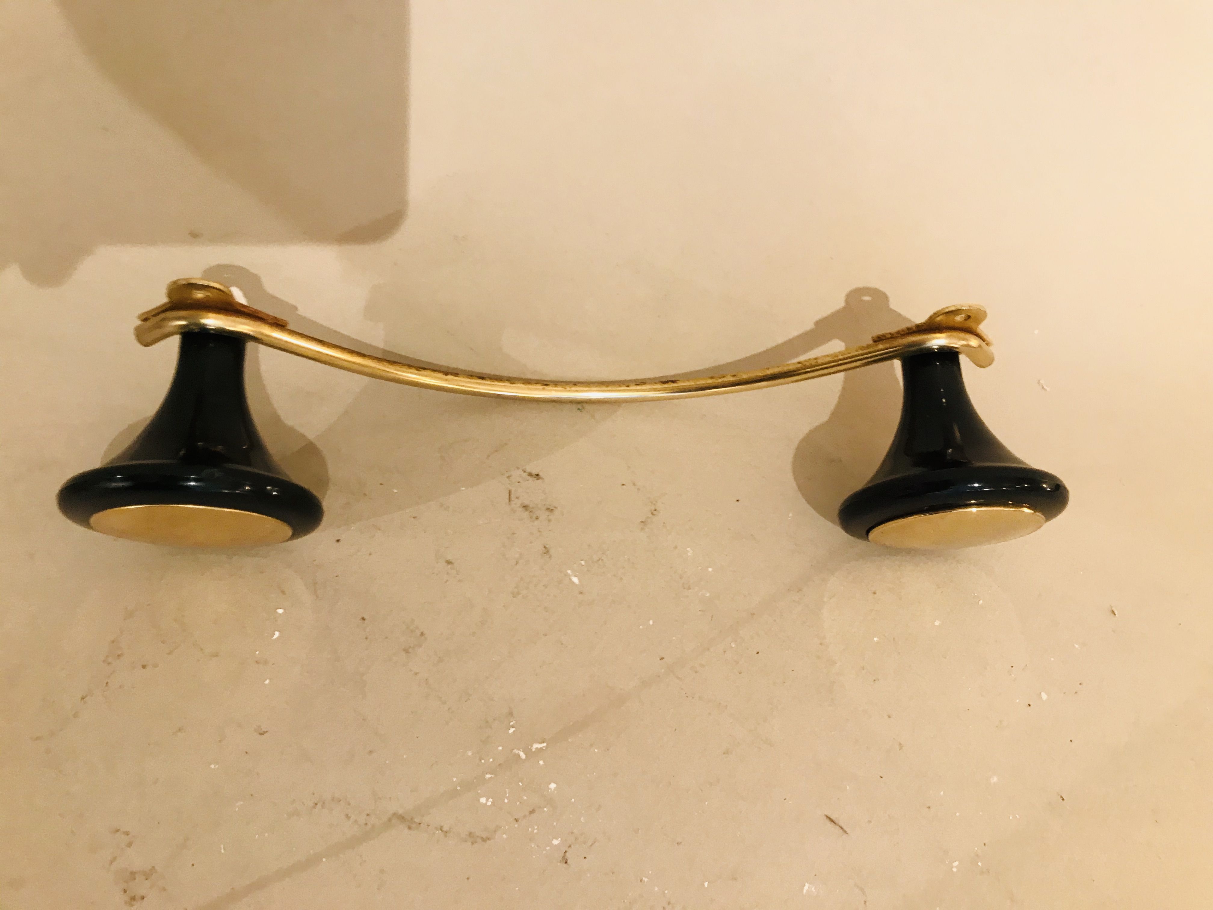 Gold and black metal coatrack 1960