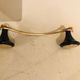 Gold and black metal coatrack 1960