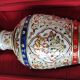 Hindu marble vase with floral decoration and gold leaf, in a box. Height 20 cm.