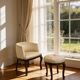 An antique Italian bar chair and a matching tufted vanity stool.