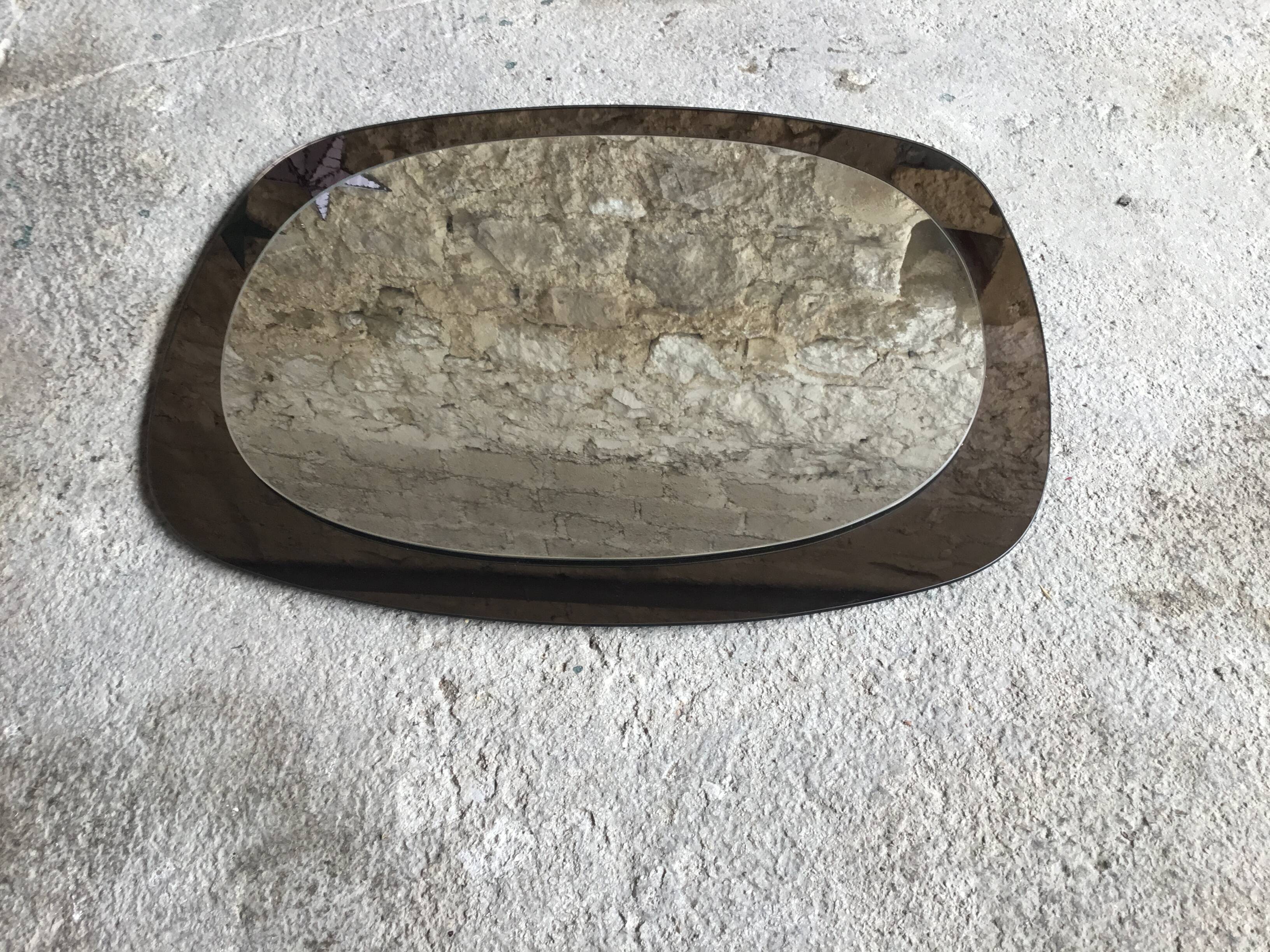 Space Age wall mirror ovoid smoked glass - design 1970