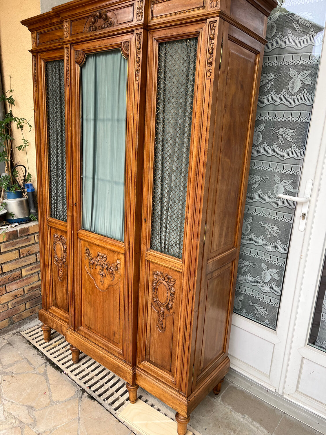 Antique carved wooden bookcase