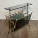 Brass magazine rack and blue-tinted glasses