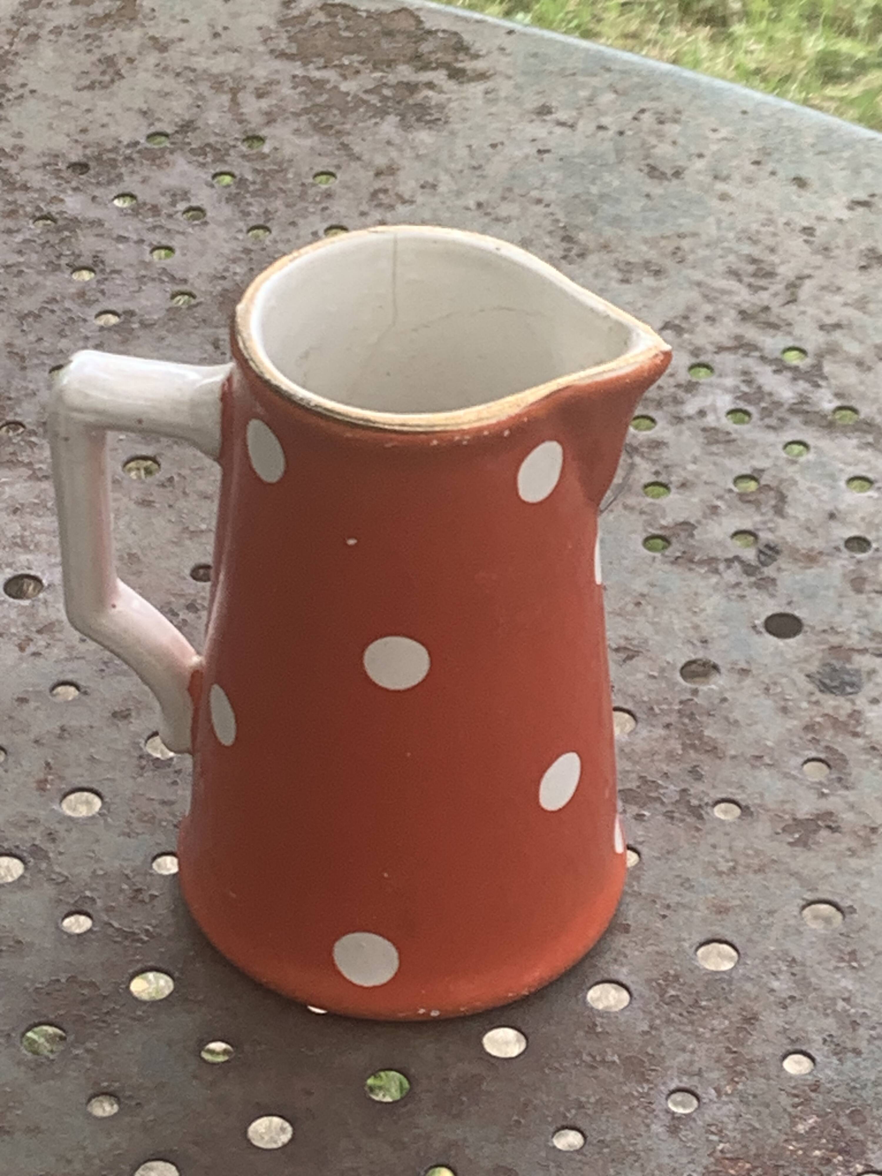 Milk jug, pitcher with white polka dots on orange earthenware, Sarreguemines and Digoin