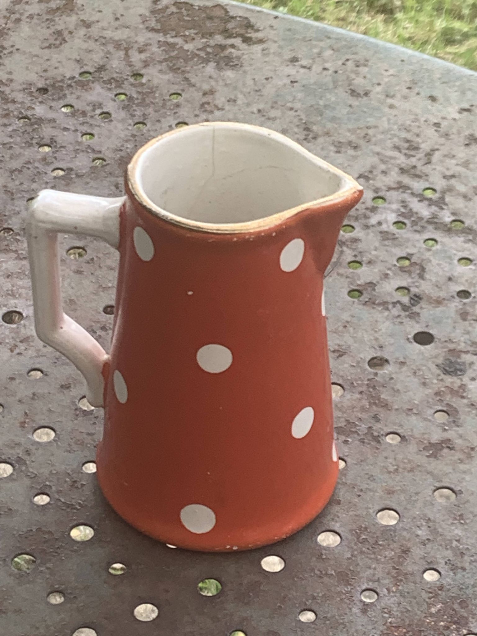 Milk jug, pitcher with white polka dots on orange earthenware, Sarreguemines and Digoin