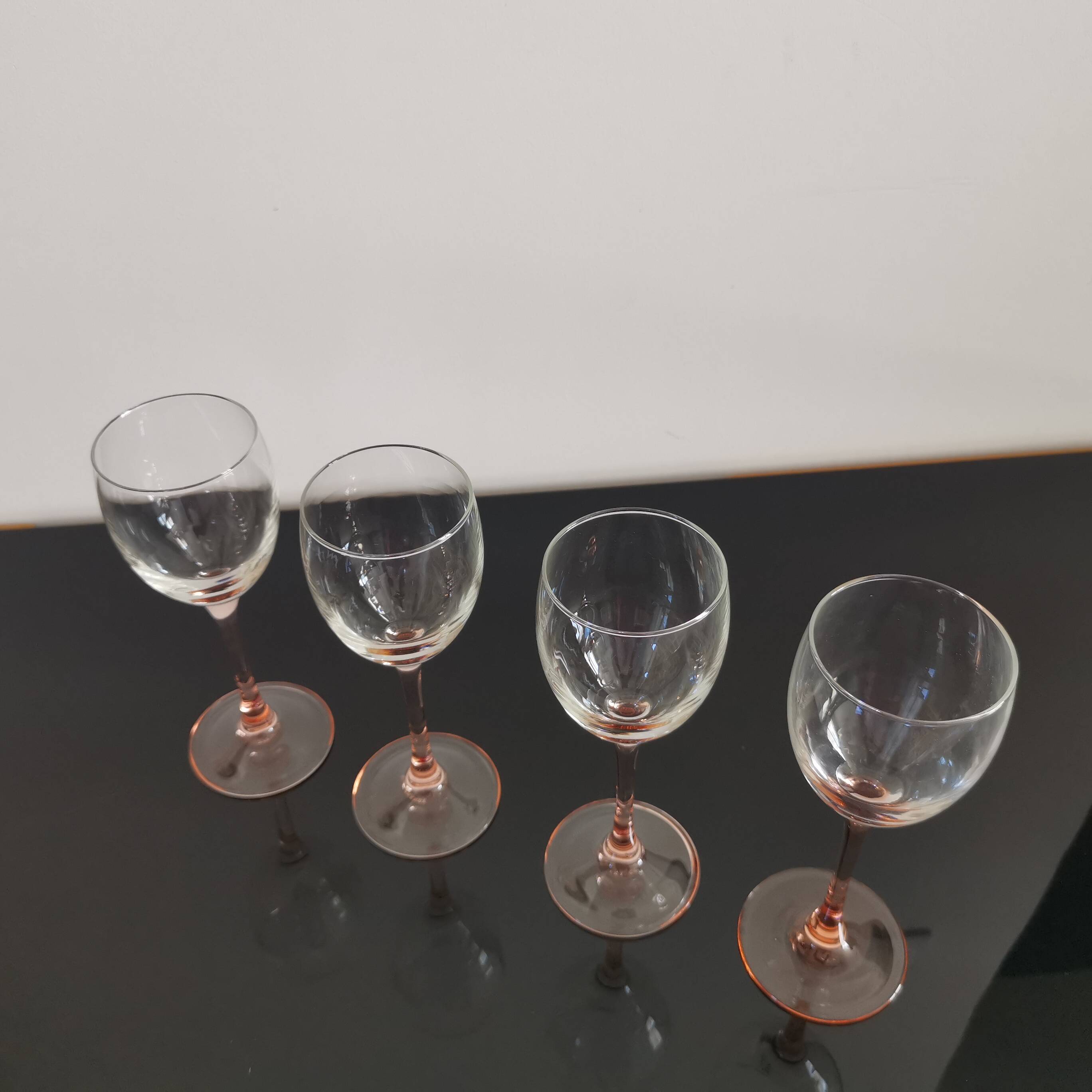 4 Luminarc white wine glasses with pink feet