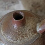 Vernified sandstone oil jar with handle