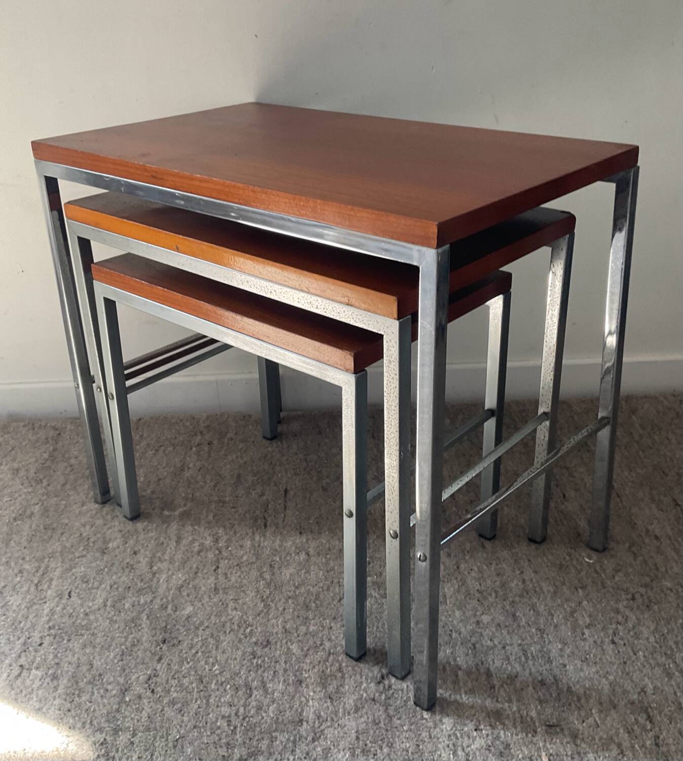 Trio of teak and chrome metal nesting tables from the 60s-70s