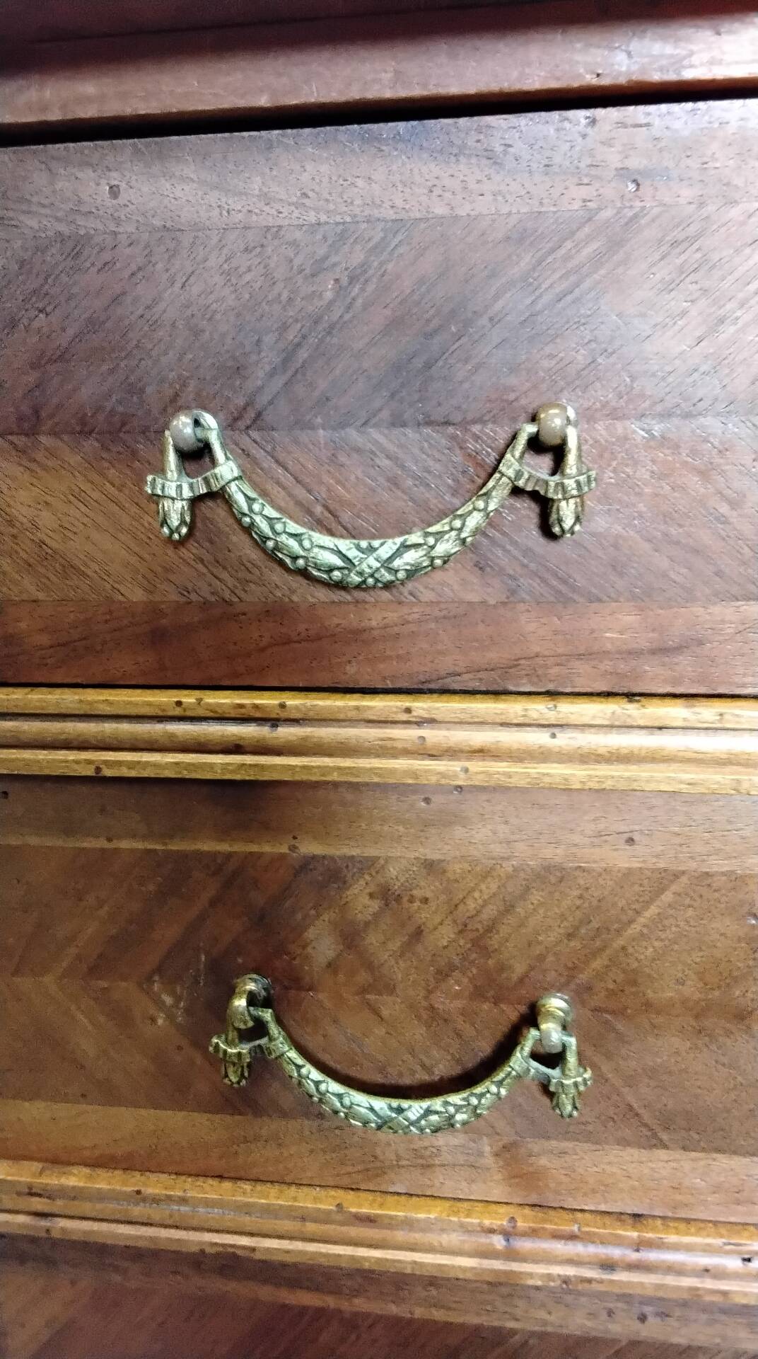 Antique marquetry commode in the Louis XVI style.