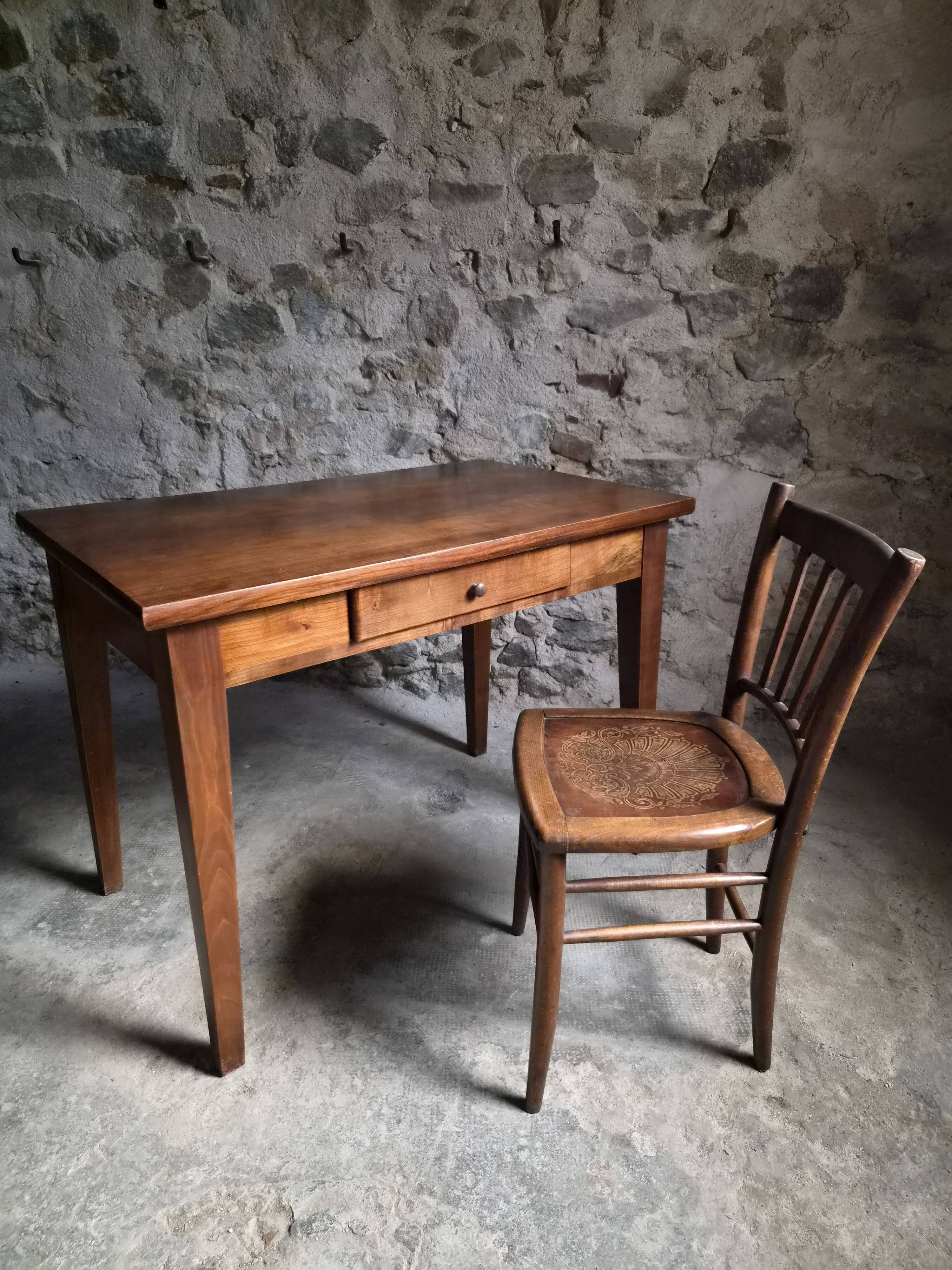 Old French table in cherry wood with bistro chair, circa 1900–1930.