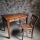 Old French table in cherry wood with bistro chair, circa 1900–1930.