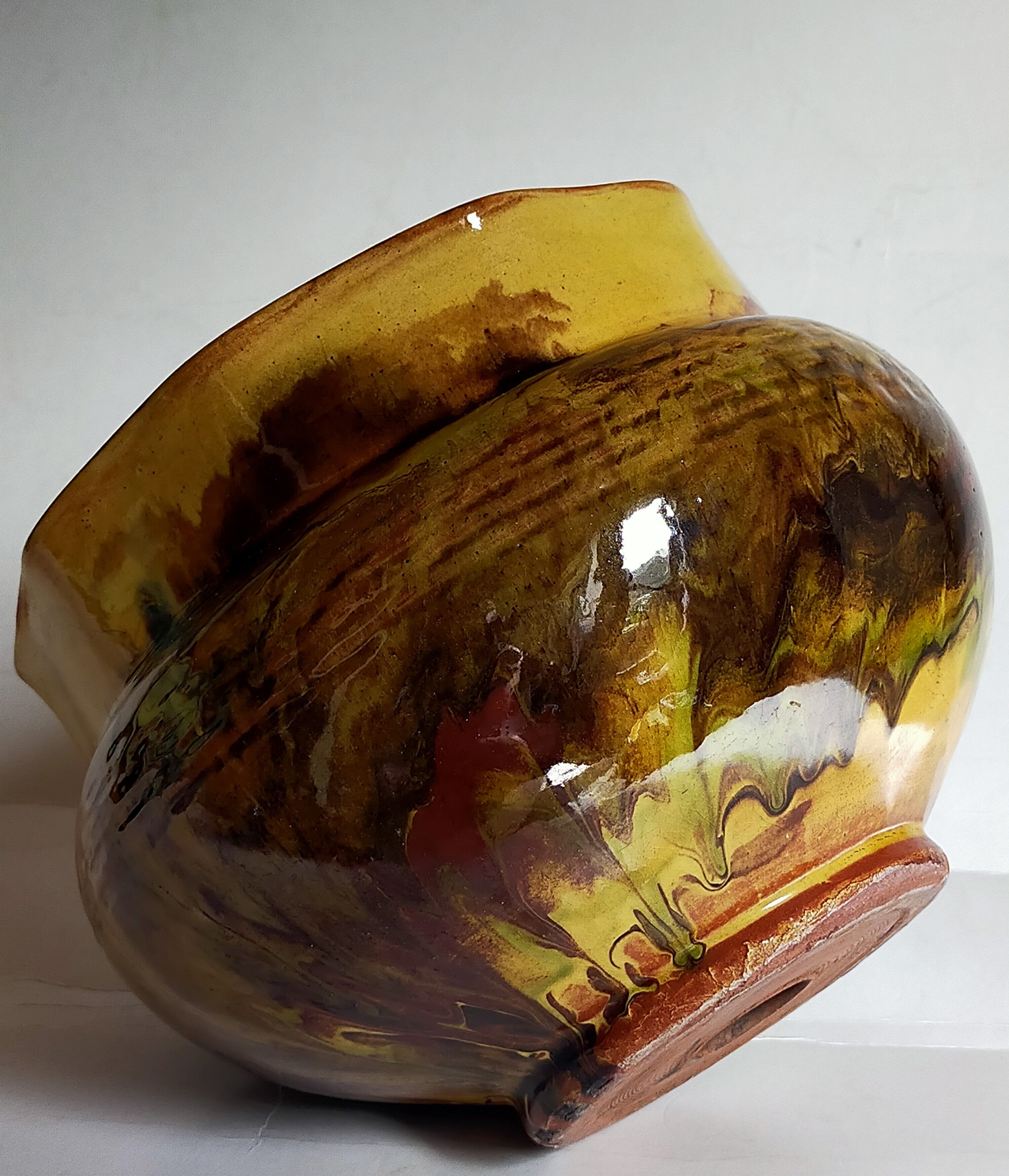 Old provencal pot cover in glazed terracotta