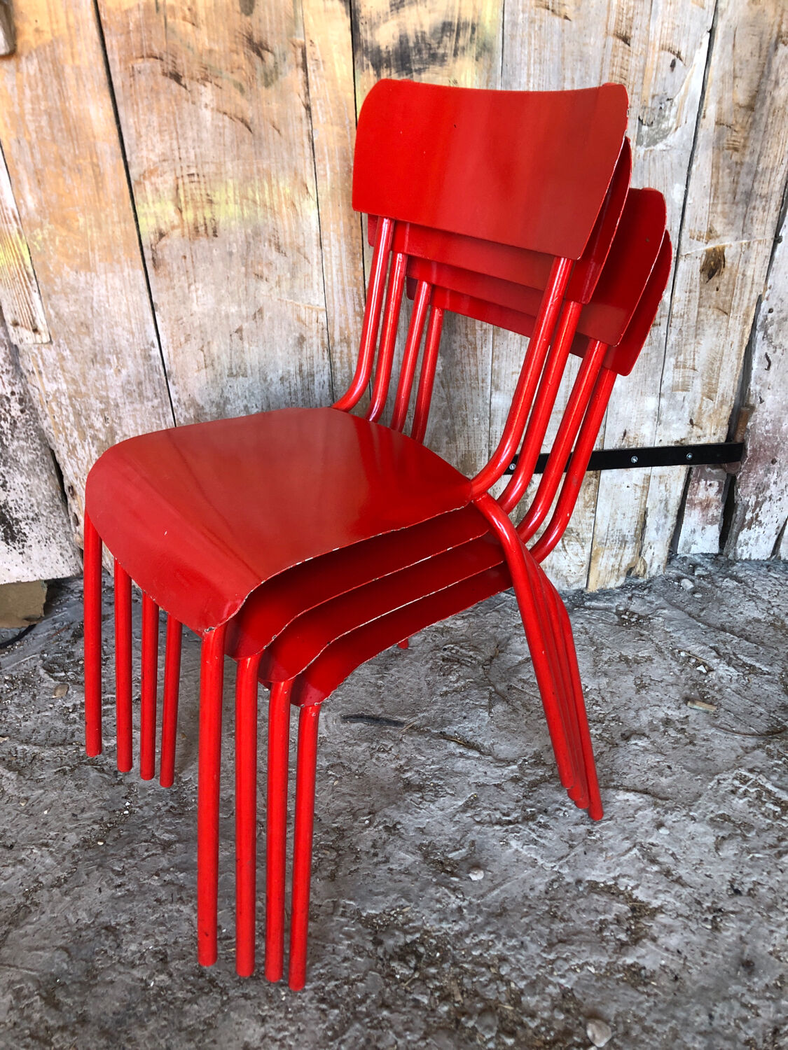Set of 4 red metal chairs
