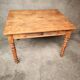 Small farmhouse table in light wood and tiled floors