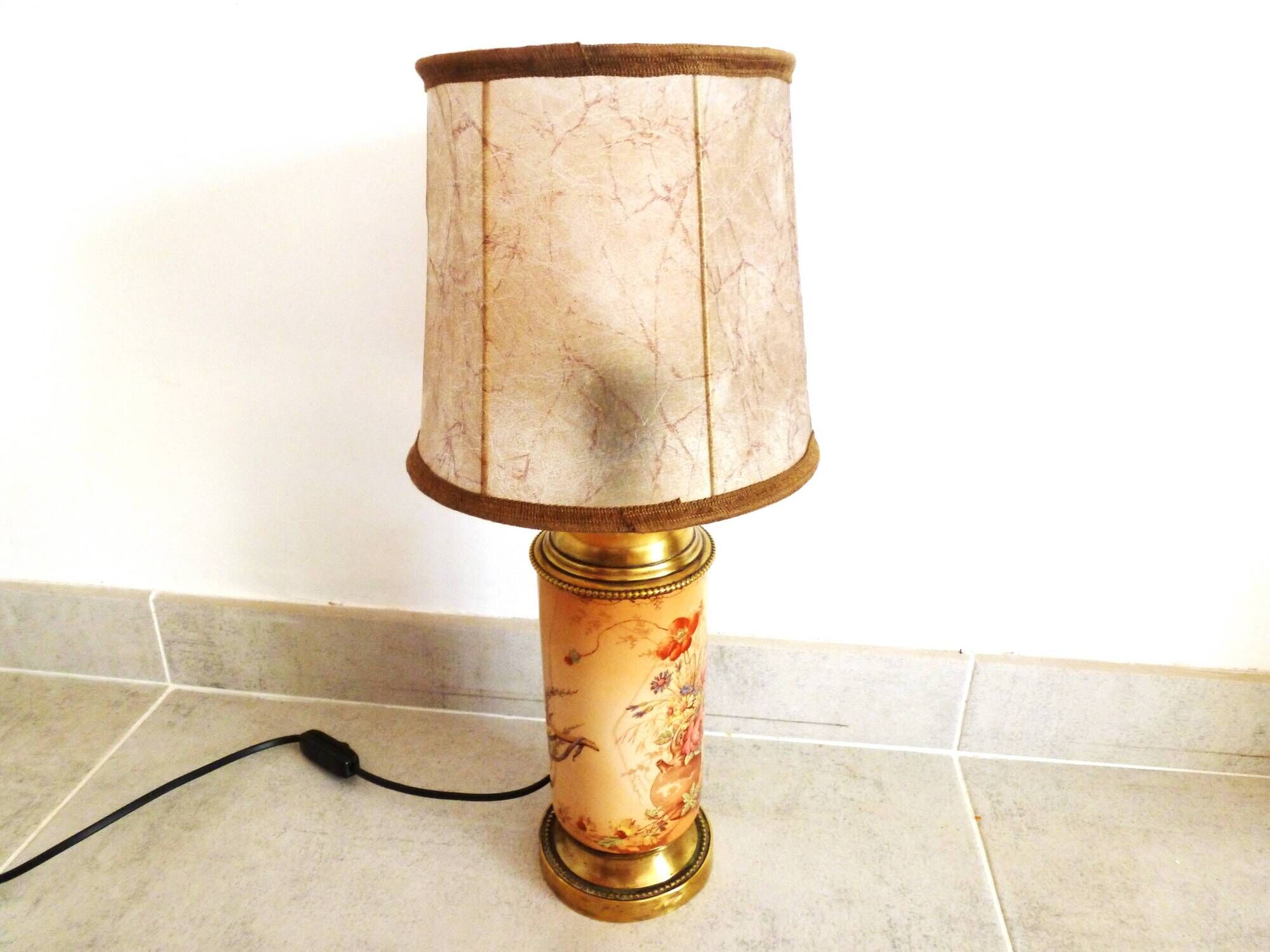 Old ceramic lamp "Lunéville" with a pig bladder shade.