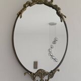 Antique mirror, oval with brass crest