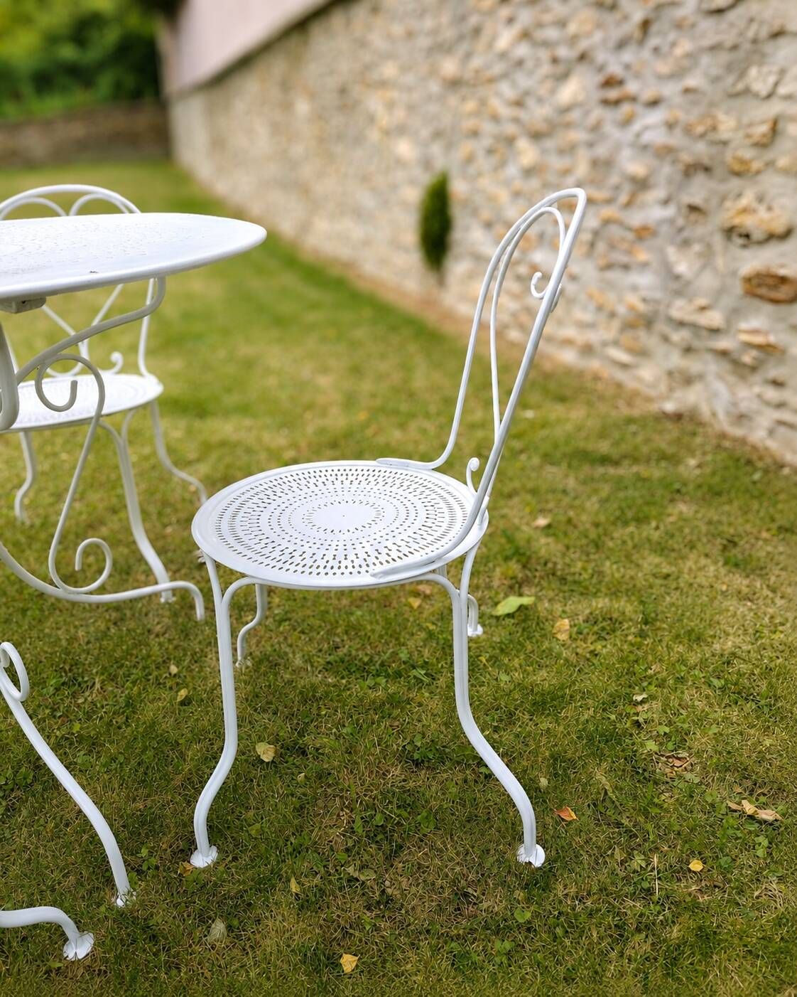 Renovated antique garden furniture in wrought iron, early 20th century.