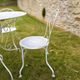 Renovated antique garden furniture in wrought iron, early 20th century.