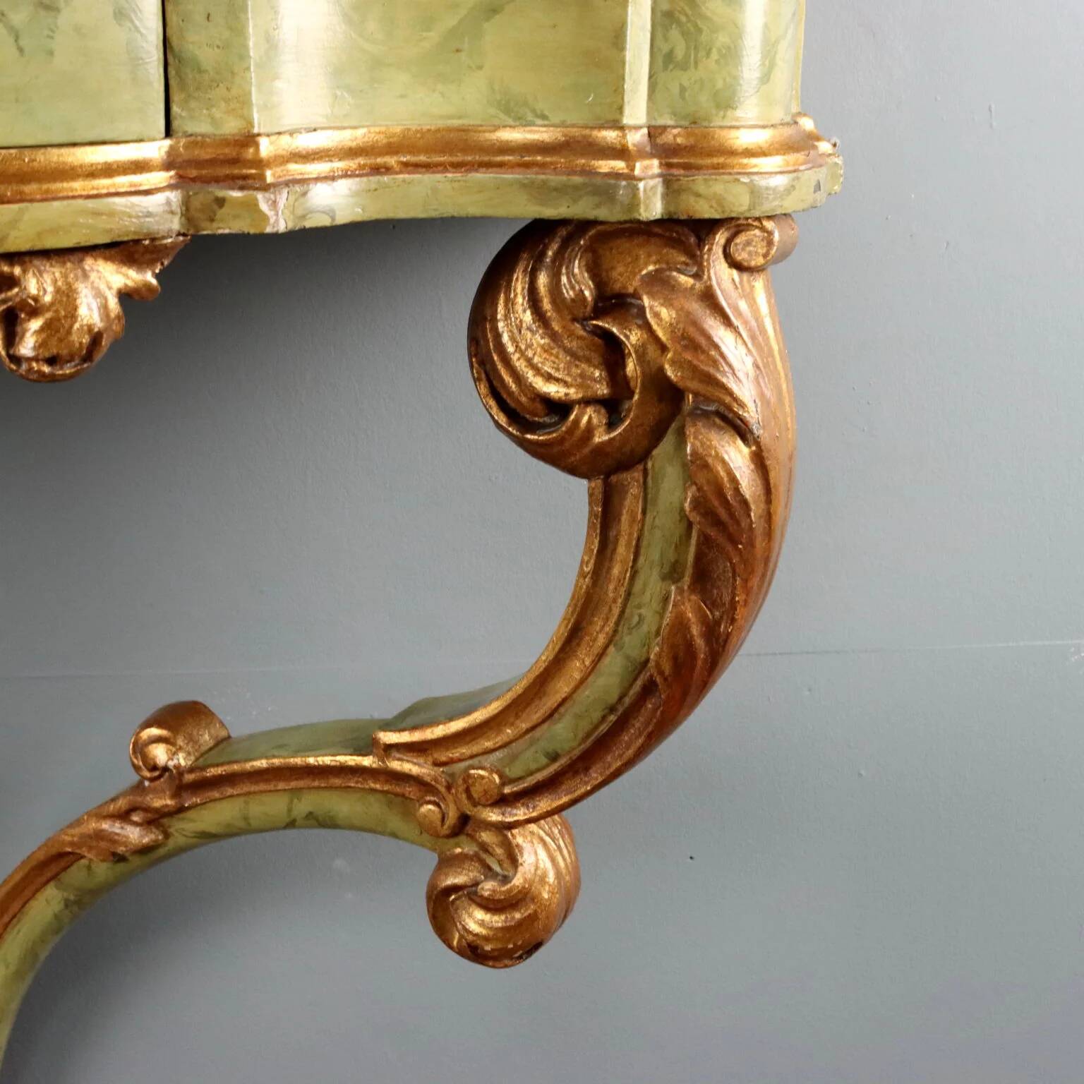 19th-century carved wooden drop-leaf console.