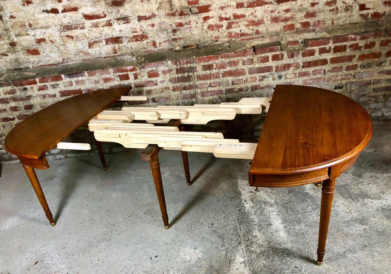Oval walnut table with 6 legs from 1m12 to 2.94 (4 extensions of 45.5 cm)