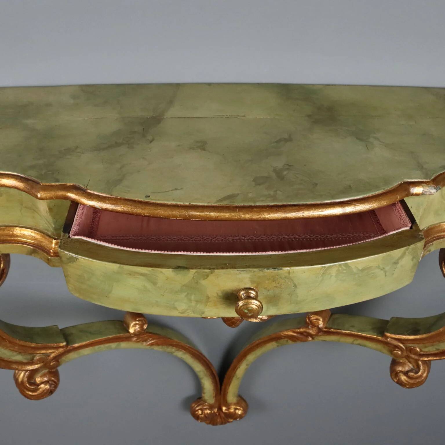 19th-century carved wooden drop-leaf console.
